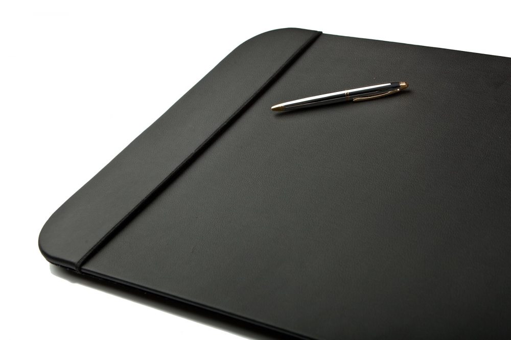 Slick Picture of desk pad with a pen black